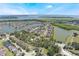 Real estate showcasing the home and the community, highlighting proximity to lush landscaping and waterfront living at 1920 Commander Way, Kissimmee, FL 34746
