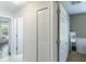 Hallway view, featuring a neutral color palette and interior doors at 1920 Commander Way, Kissimmee, FL 34746