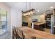 View of open concept kitchen with stainless steel appliances and spacious island with seating at 1920 Commander Way, Kissimmee, FL 34746