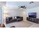 Spacious living area with tile flooring, neutral walls, and a comfortable sectional sofa at 1920 Commander Way, Kissimmee, FL 34746