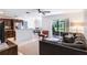 Open-concept living room with tile floors, lots of natural light, and comfortable seating arrangements at 1920 Commander Way, Kissimmee, FL 34746