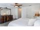 Primary bedroom featuring an antique dresser and a ceiling fan, creating a cozy retreat at 1920 Commander Way, Kissimmee, FL 34746