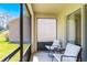 Enclosed porch with comfortable seating at 1920 Commander Way, Kissimmee, FL 34746