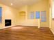 A bright living room features wood floors, a fireplace, and large windows for natural light at 1980 Erving Cir # 107, Ocoee, FL 34761