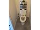 Cozy bathroom with tiled floors, toilet, and storage shelves, perfect for small spaces at 2232 Tay Wes Dr, St Cloud, FL 34771