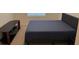 Bedroom featuring a cozy bed, a sleek tv stand, and a nightstand by the window at 2232 Tay Wes Dr, St Cloud, FL 34771