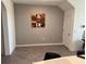 A simple dining room with neutral walls, tile flooring, and a wine-themed artwork at 2232 Tay Wes Dr, St Cloud, FL 34771