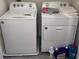 Well-lit laundry area complete with a washing machine and a dryer with laundry supplies at 2232 Tay Wes Dr, St Cloud, FL 34771