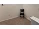 Neutral corner room with chair and neutral carpet at 2232 Tay Wes Dr, St Cloud, FL 34771