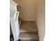 Carpeted staircase with white railing providing access to the upper level of the house at 2232 Tay Wes Dr, St Cloud, FL 34771