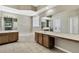 Spa-like bathroom featuring dual sinks, a soaking tub, and a walk-in shower at 2425 Rambling Oaks Way, Kissimmee, FL 34746