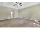 Spacious bedroom featuring plush carpet and neutral walls and trim at 2425 Rambling Oaks Way, Kissimmee, FL 34746
