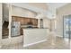 Bright kitchen featuring stainless steel appliances, and tile flooring at 2425 Rambling Oaks Way, Kissimmee, FL 34746