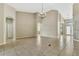 Expansive living area with tile floors, high ceilings, and modern lighting fixtures at 2425 Rambling Oaks Way, Kissimmee, FL 34746