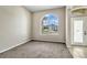 Bright, airy living room with neutral walls and carpet, showcasing the home's natural light at 2425 Rambling Oaks Way, Kissimmee, FL 34746