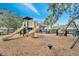 Community playground with slides and swings for fun, near the pool, within a fenced area at 2425 Rambling Oaks Way, Kissimmee, FL 34746