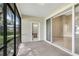 Screened porch with access to the interior and exterior areas at 2425 Rambling Oaks Way, Kissimmee, FL 34746