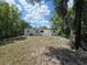 A view of the back of the home showing a fire pit and an exterior building at 247 S Marydell Ave, Deland, FL 32720