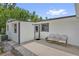The home's exterior has a cozy patio area perfect for relaxing and outdoor seating at 247 S Marydell Ave, Deland, FL 32720