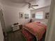 Bright bedroom with a floral bedspread, stylish furnishings, and natural light at 247 S Marydell Ave, Deland, FL 32720