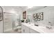 Modern bathroom featuring double sinks, a glass-enclosed shower, and contemporary fixtures at 2592 Penguin Blvd, Davenport, FL 33837