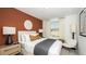 Bedroom with a modern design, a comfortable bed, and natural light from a window at 2592 Penguin Blvd, Davenport, FL 33837