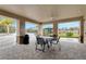 Covered seating area with a view of the pool and playground at 2592 Penguin Blvd, Davenport, FL 33837
