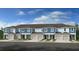 Beautiful new construction townhomes with attached garages and manicured landscaping at 2592 Penguin Blvd, Davenport, FL 33837