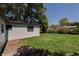 The backyard offers plenty of room to run and play, and mature trees offer shade and energy efficiency at 2827 Sanka Dr, Orlando, FL 32826