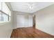 Bright bedroom features wood flooring and a closet at 2827 Sanka Dr, Orlando, FL 32826