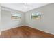 Cozy bedroom features wood flooring and natural light at 2827 Sanka Dr, Orlando, FL 32826
