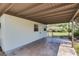 Spacious carport offers covered parking and access to the backyard, with ample space for outdoor activities at 2827 Sanka Dr, Orlando, FL 32826