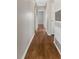 Hallway with wood floors and leading into other rooms of the house at 2827 Sanka Dr, Orlando, FL 32826