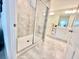 Modern bathroom with a walk-in shower featuring glass door and tile surround, and vanity with storage at 3120 Paradox Cir # 101, Kissimmee, FL 34746