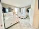 Comfortable bedroom featuring two beds with drawer storage, a flat-screen TV, and stylish wall decor at 3120 Paradox Cir # 101, Kissimmee, FL 34746