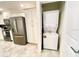 Convenient laundry area adjacent to the kitchen featuring a stackable washer and dryer at 3120 Paradox Cir # 101, Kissimmee, FL 34746