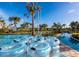A view of the community's lazy river, showcasing clear tubes for a leisurely ride at 3120 Paradox Cir # 101, Kissimmee, FL 34746