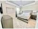 Comfortable main bedroom with tray ceiling, modern decor, and ample natural light at 3120 Paradox Cir # 101, Kissimmee, FL 34746