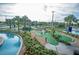A beautifully landscaped miniature golf course with water features and lush greenery at 3120 Paradox Cir # 101, Kissimmee, FL 34746