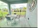 Outdoor patio with seating, offering a view of the community and green space, perfect for relaxing at 3120 Paradox Cir # 101, Kissimmee, FL 34746