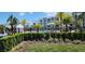 Community pool area with lush landscaping, lounge chairs, and clear blue water, perfect for relaxation at 3120 Paradox Cir # 101, Kissimmee, FL 34746
