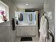 Modern bathroom with a double vanity, backlit mirrors, and contemporary design at 3131 Lowndes Dr, Winter Park, FL 32792