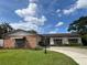 Charming single-story home with well-manicured lawn and inviting curb appeal at 3131 Lowndes Dr, Winter Park, FL 32792