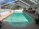 Large screened-in pool and patio area, perfect for relaxing and entertaining at 3131 Lowndes Dr, Winter Park, FL 32792