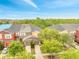 Aerial shot of residential homes with well-maintained yards, lush trees, and a serene view of the surrounding area at 3166 Rodrick Cir, Orlando, FL 32824