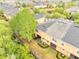 Well-maintained backyard with a black fence, lush greenery, and mature tree providing shade and privacy at 3166 Rodrick Cir, Orlando, FL 32824