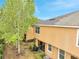 Aerial view of a backyard featuring a screened-in patio, well-maintained greenery, and neighboring homes at 3166 Rodrick Cir, Orlando, FL 32824