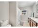 Bathroom with dark wood cabinets and granite countertop at 3166 Rodrick Cir, Orlando, FL 32824