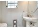 Simple powder room featuring a pedestal sink and neutral wall color at 3166 Rodrick Cir, Orlando, FL 32824