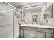 Bathroom with double sink, granite countertop, large mirror, and glass shower at 3166 Rodrick Cir, Orlando, FL 32824